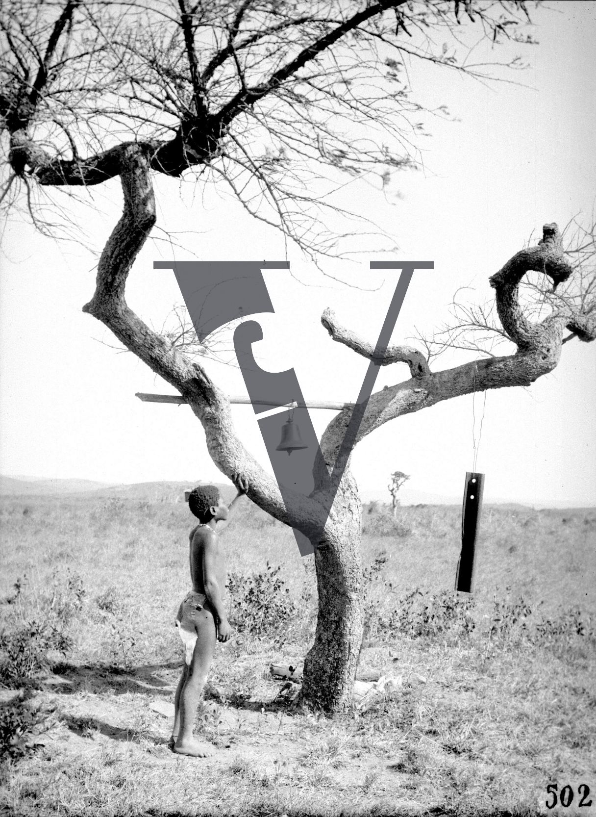 Siliva the Zulu, Production still, boy by tree bells.