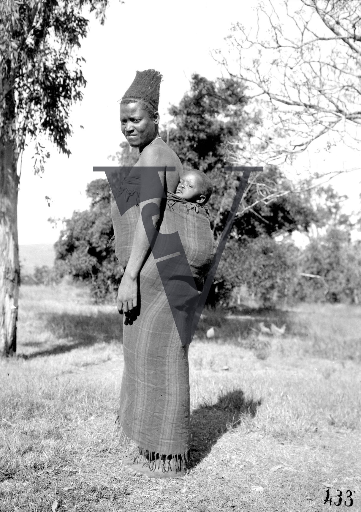 Siliva the Zulu, Production still, woman, baby on back.