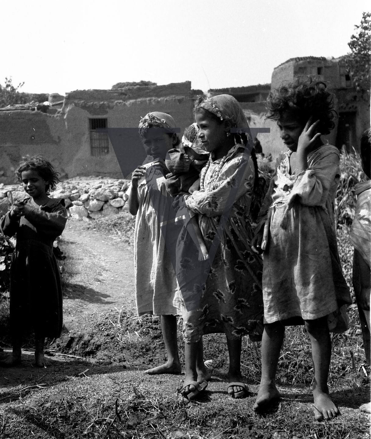 Harrania, Egypt, children stand around.