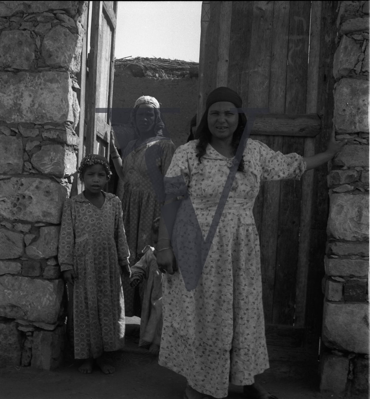 Harrania, Egypt, women at door of house.