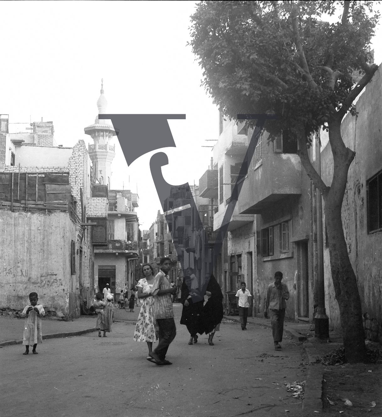 Harrania, Egypt, streetview of buildings and people.