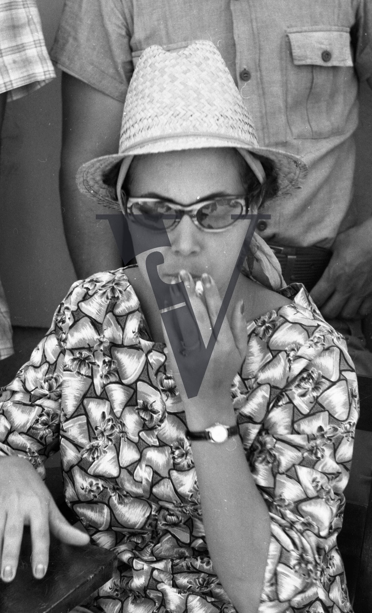 Cuba, Havana, May 1st, woman smoking.
