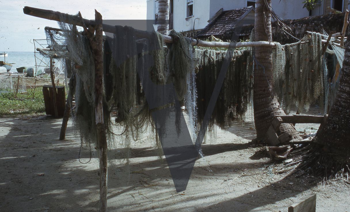 Jamaica, Fishing nets drying by the sea.