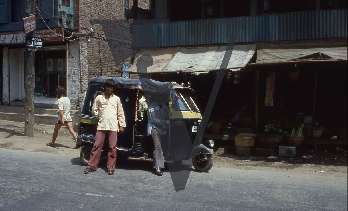 Kashmir, Motorcycle taxi, street scene.