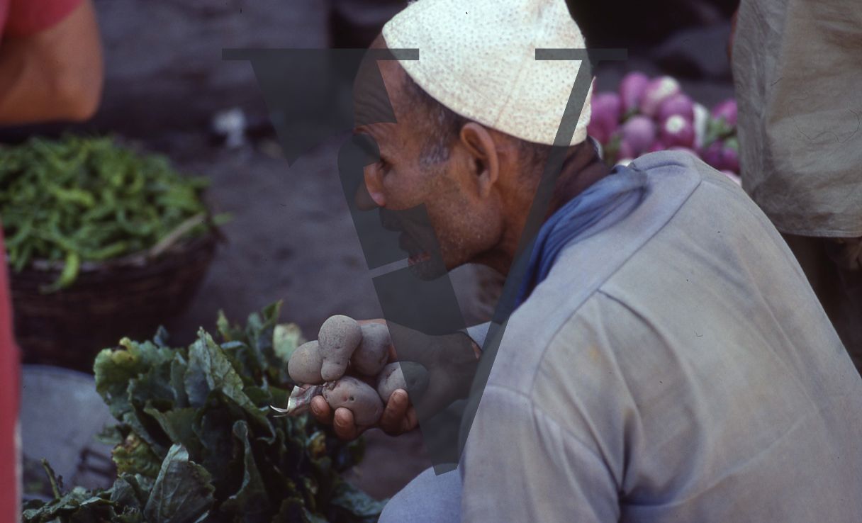 Kashmir, Man selling vegetables.