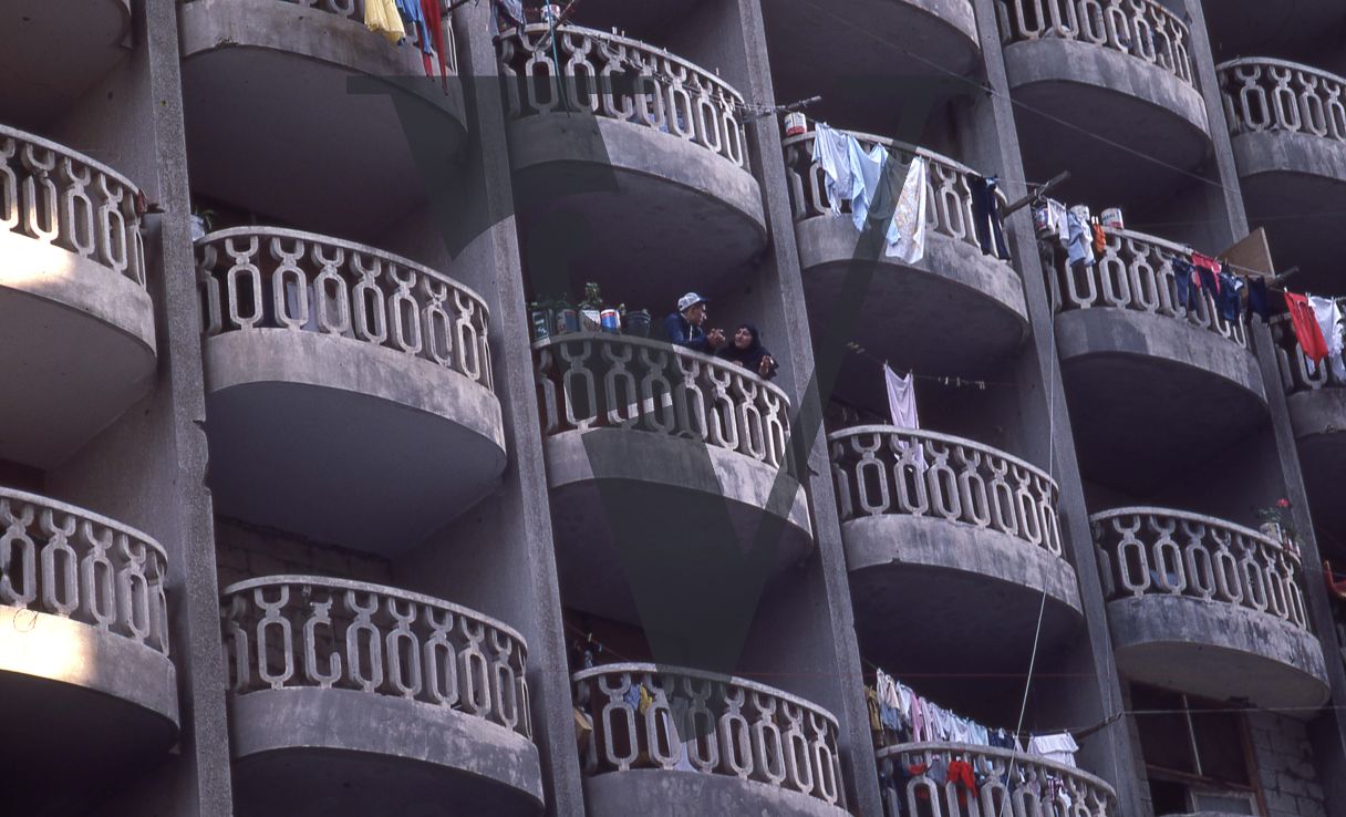 Lebanon, Beirut, Apartment building, people on balcony.