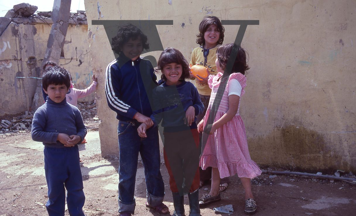 Lebanon, Refugee Camp, Sidon, children smile for camera, portrait, water balloon.