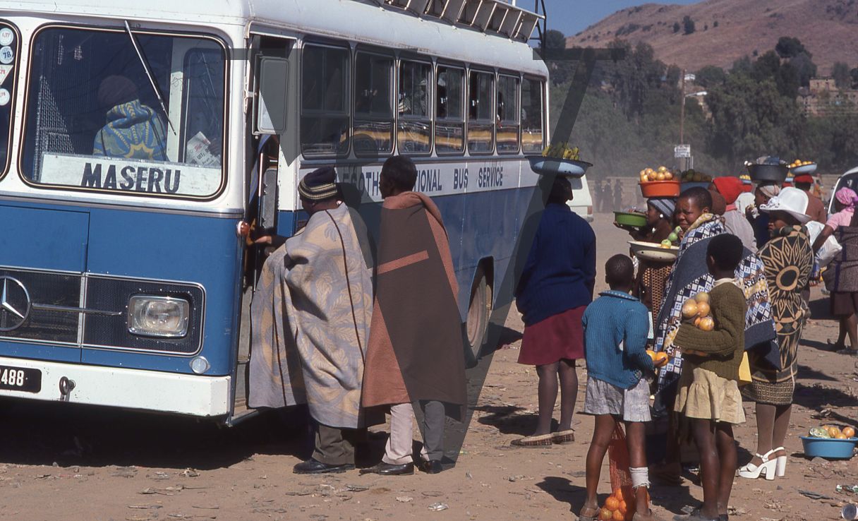 Lesotho, Maseru bus service, people boarding.
