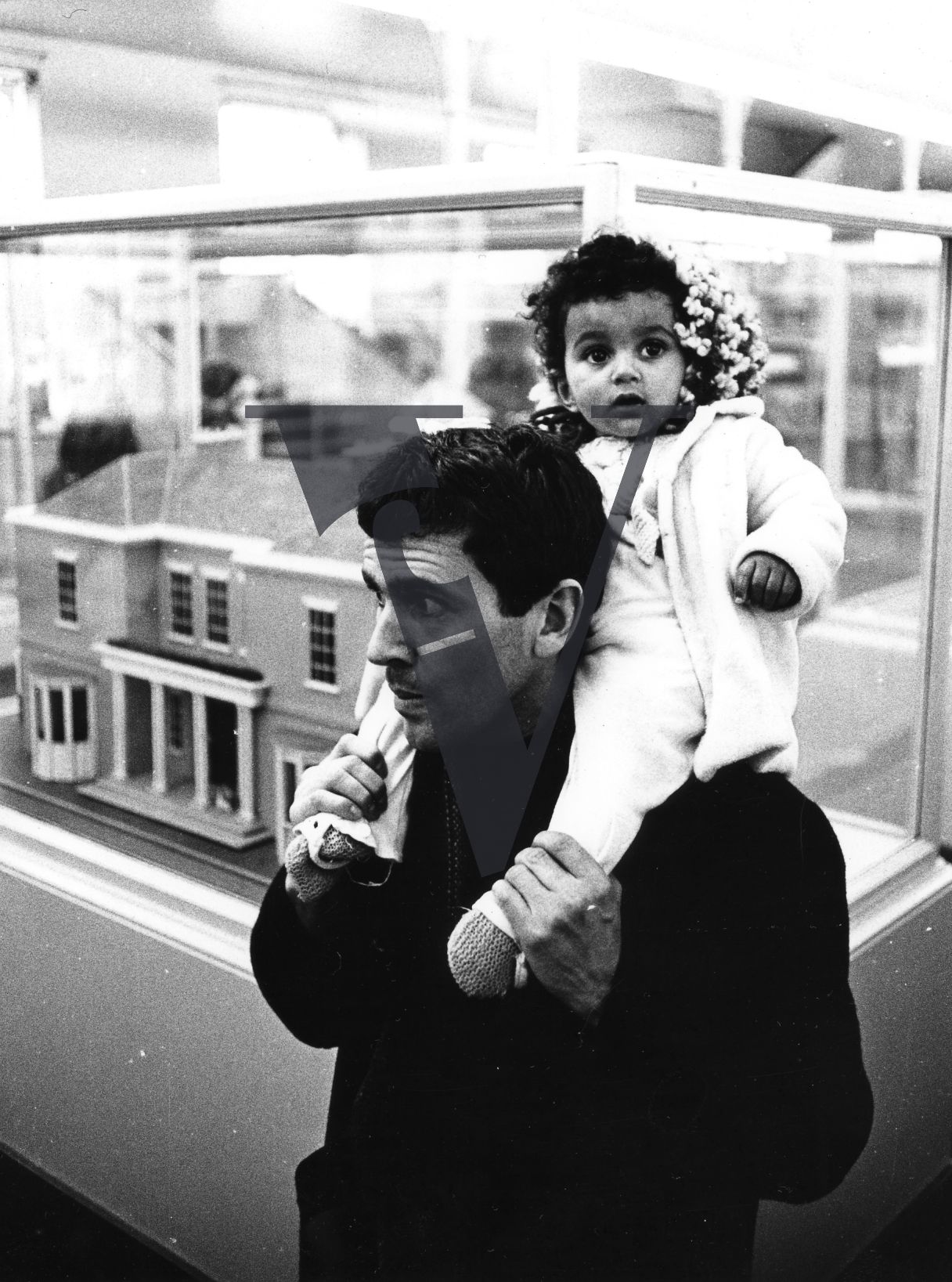 London, Sixties, Peter Davis with child on shoulders.