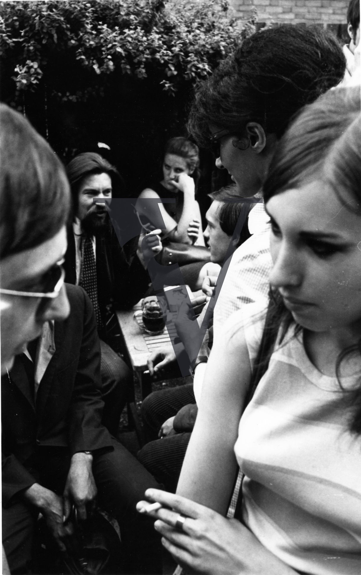 London, Sixties, gathering, drinks and cigarettes.