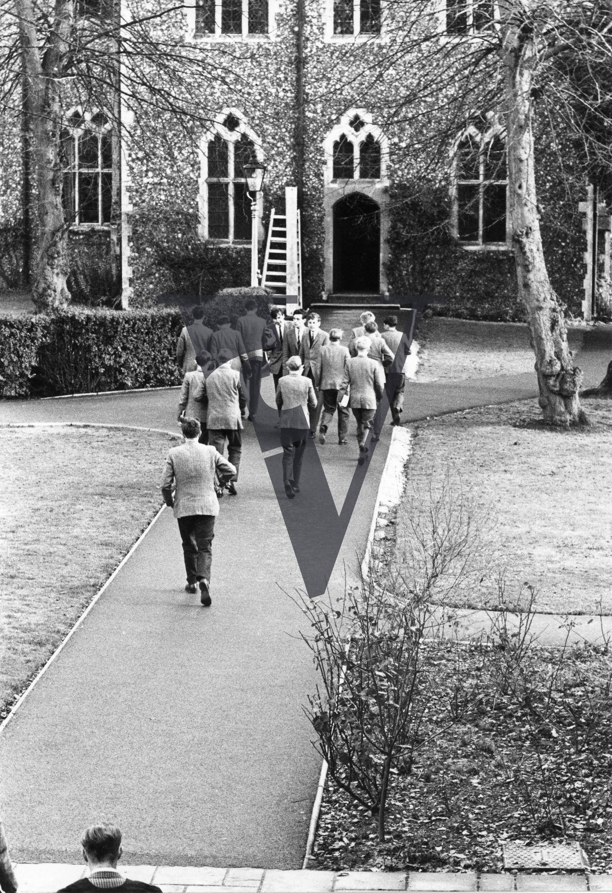 Public School, West Sussex, suited boys crossing the quad.