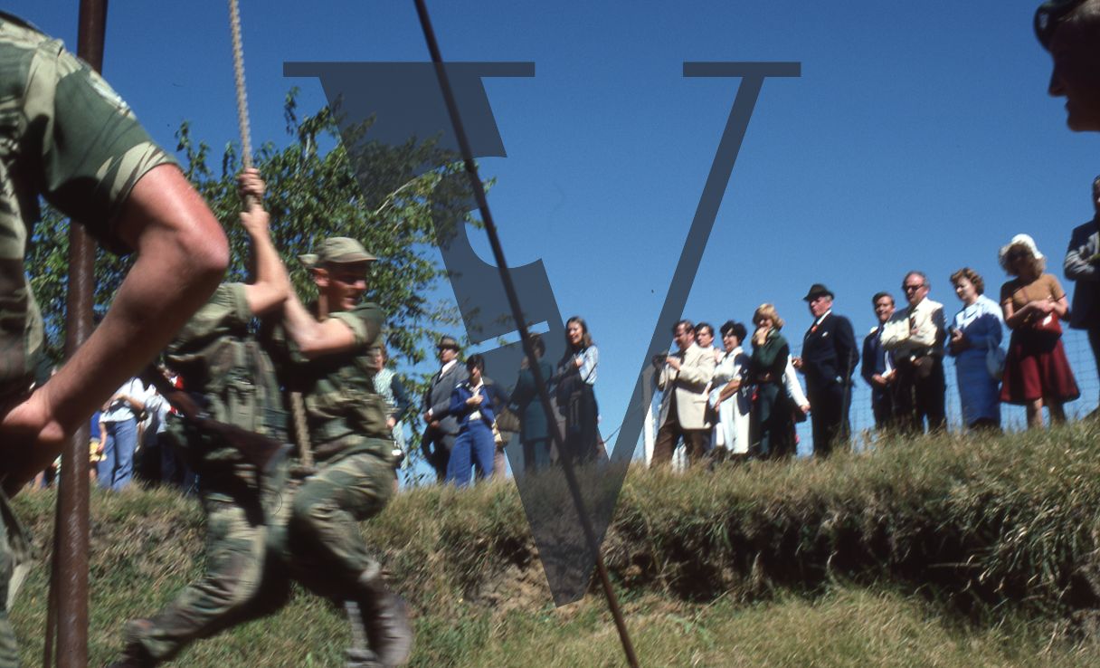 Rhodesia, Rhodesian Light Infantry, passing out ceremony, soldiers competing, small crowd onlooking.