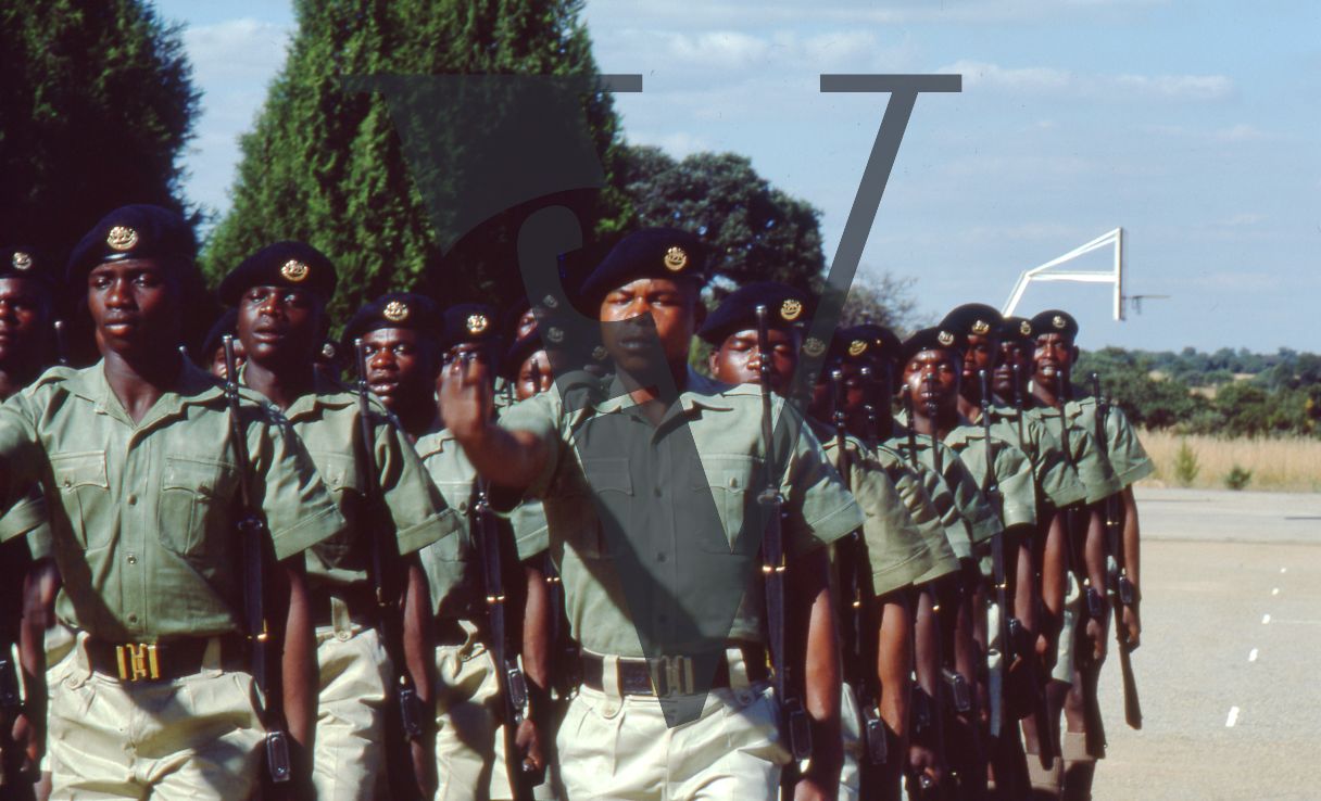 Rhodesia, Rhodesian Light Infantry, soldiers marching, military training area, wide shot.