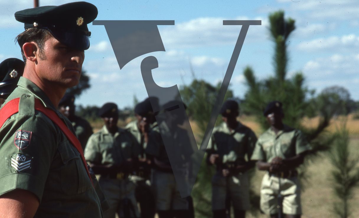 Rhodesia, Rhodesian African Rifles parading, sergeant, red sash, soldiers, mid-shot.