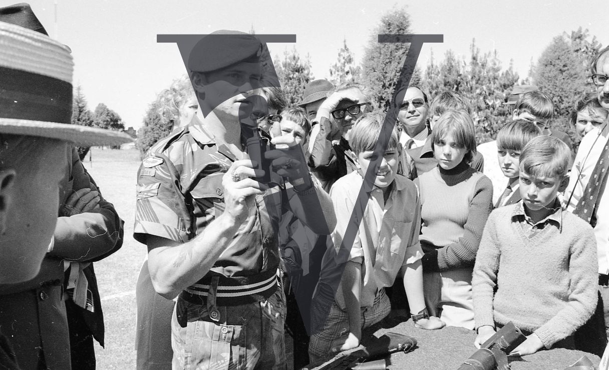 Rhodesia, Rhodesian Light Infantry, passing out ceremony, soldier with grenade, public demonstration, small crowd, mid-shot.