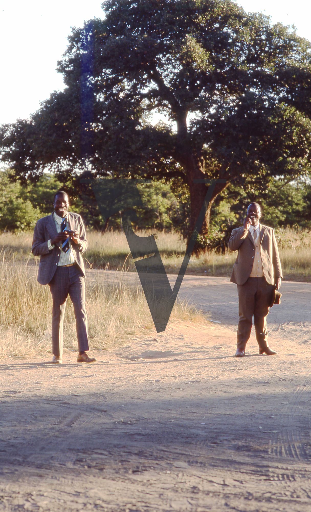 Rhodesia, landscape, two suited men, portrait, full shot.