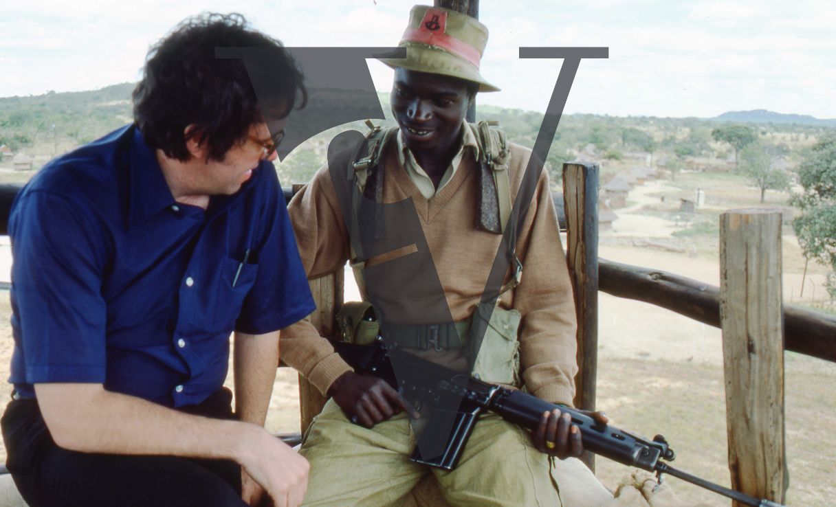 Rhodesia, “protected village”, Barry Callaghan with guard in gun tower, FN FAL battle rifle.