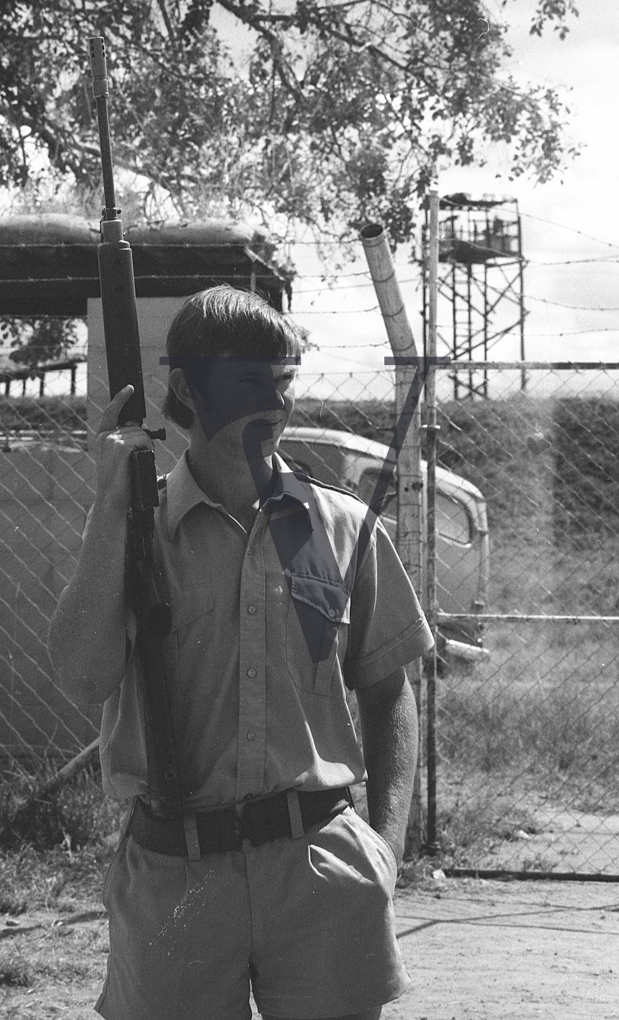 Rhodesia, “protected village”, young guard with FN FAL battle rifle, portrait.