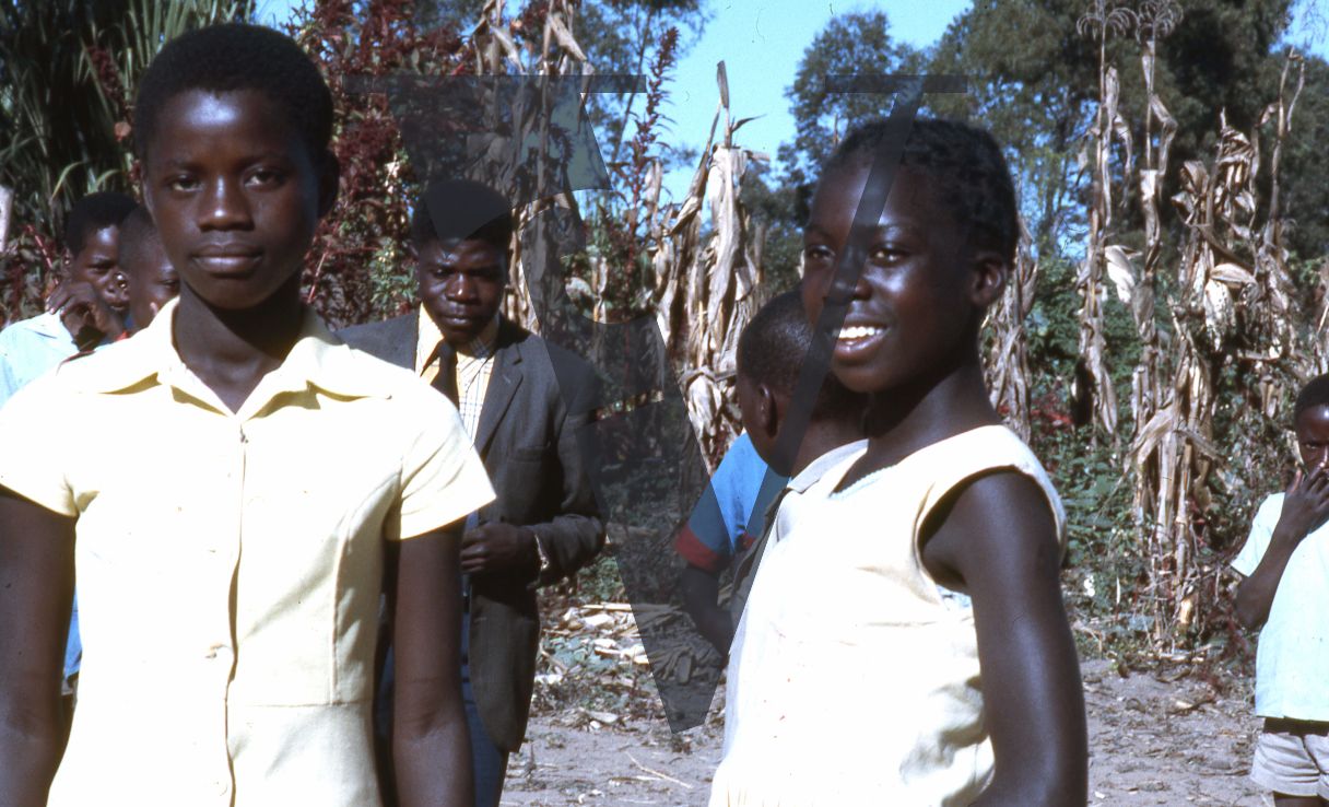 Rhodesia, tobacco farm, man, children, portrait, mid-shot.