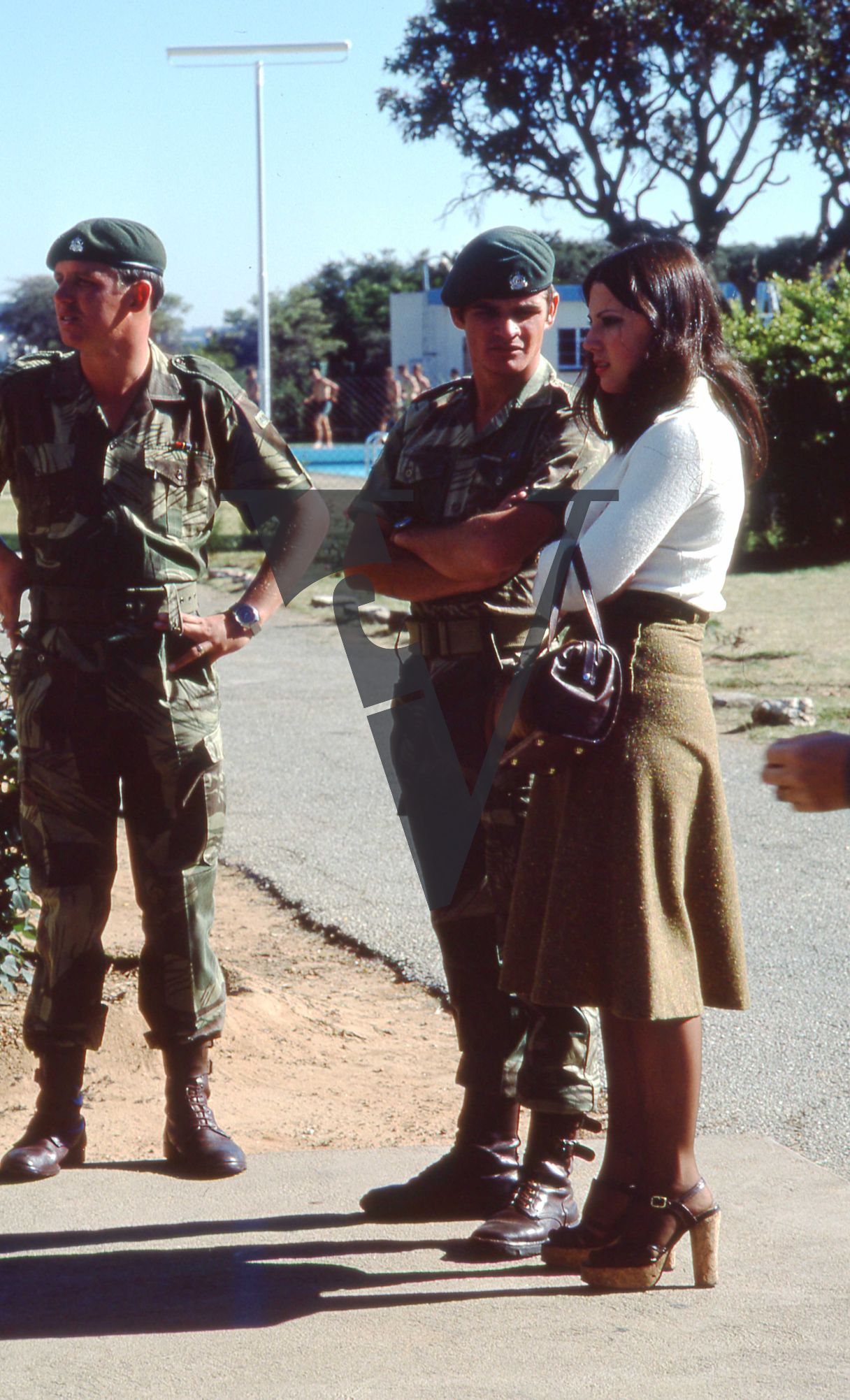 Rhodesia, Rhodesian Light Infantry, soldiers, woman, candid, full shot.