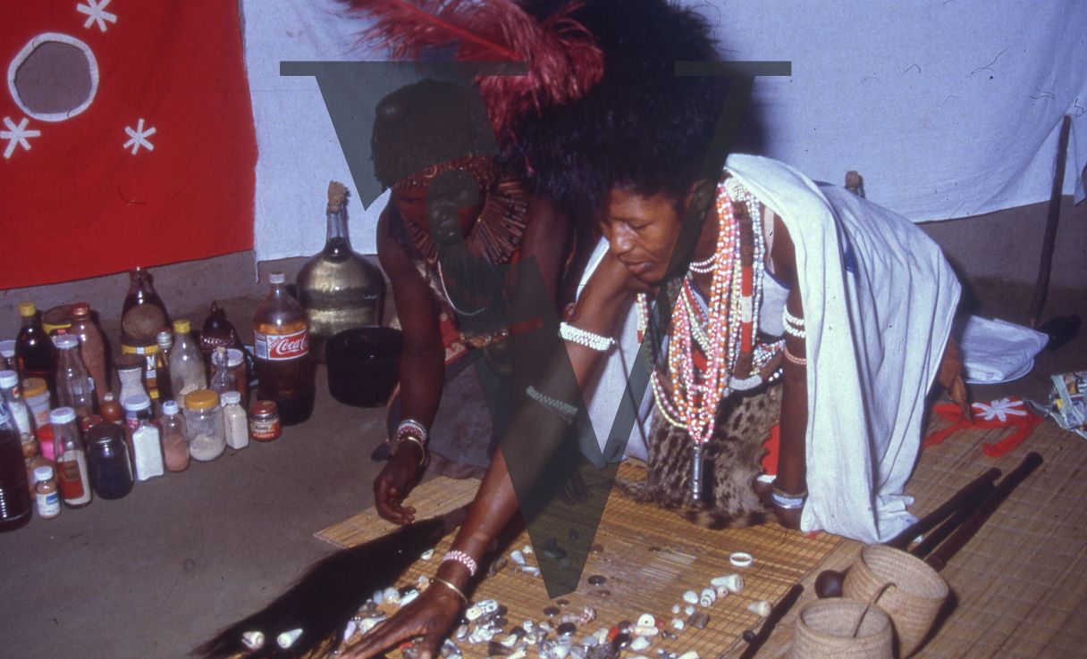 Sangoma, Zululand, two Inyangas on mat.