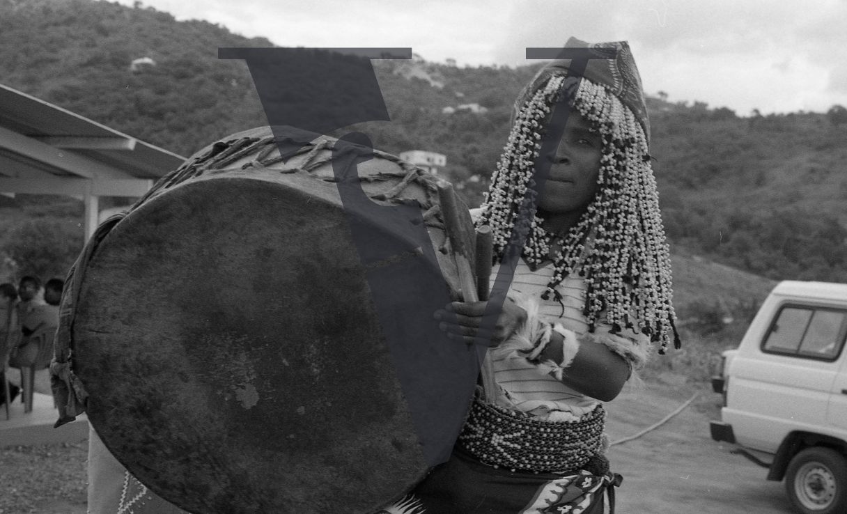 Sangoma, Zululand, headress, drum skin, playing, portrait.