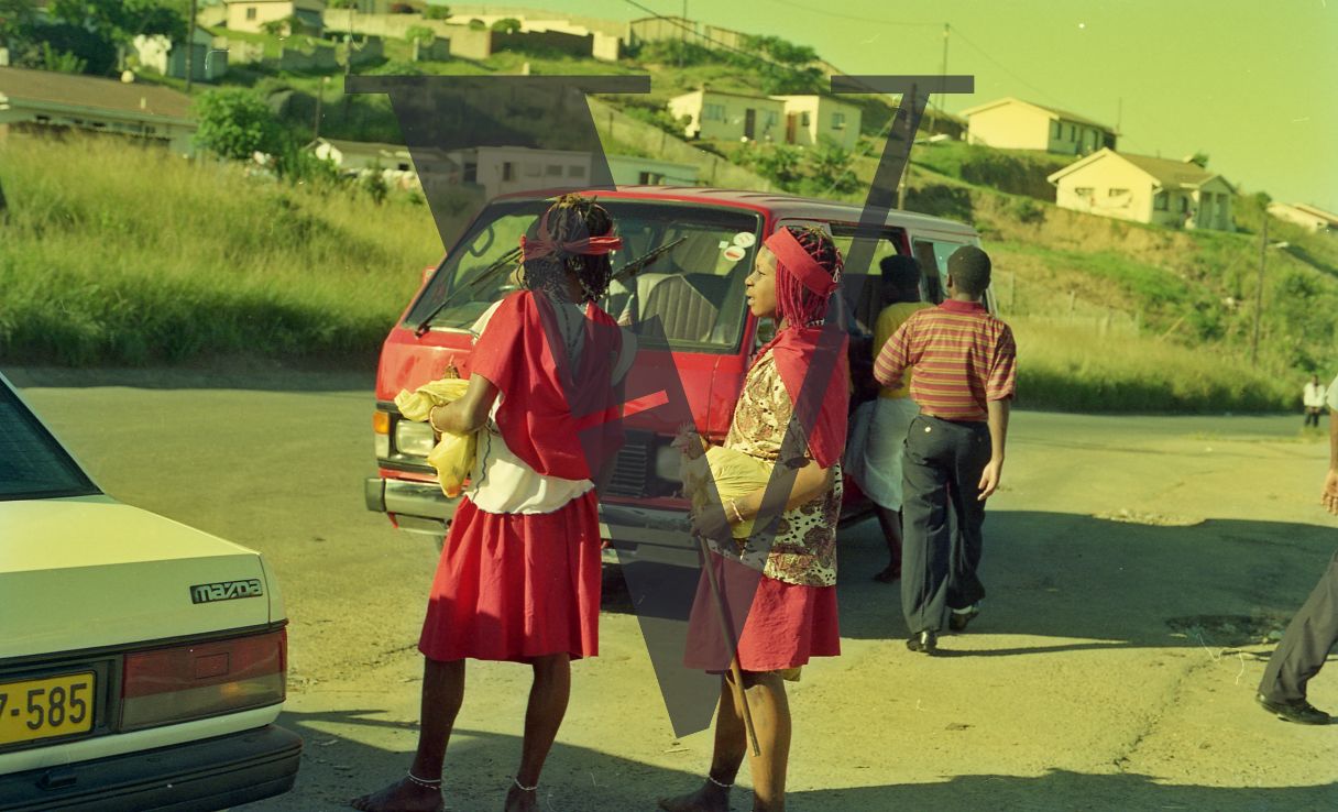 Sangoma, Zululand, Inyanga, two young Sangom's in red, chickens.