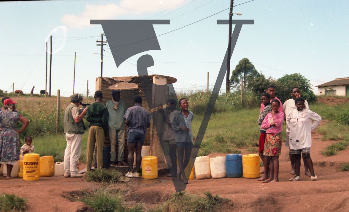 Sangoma, Zululand, Inyanga, group by water fountain.