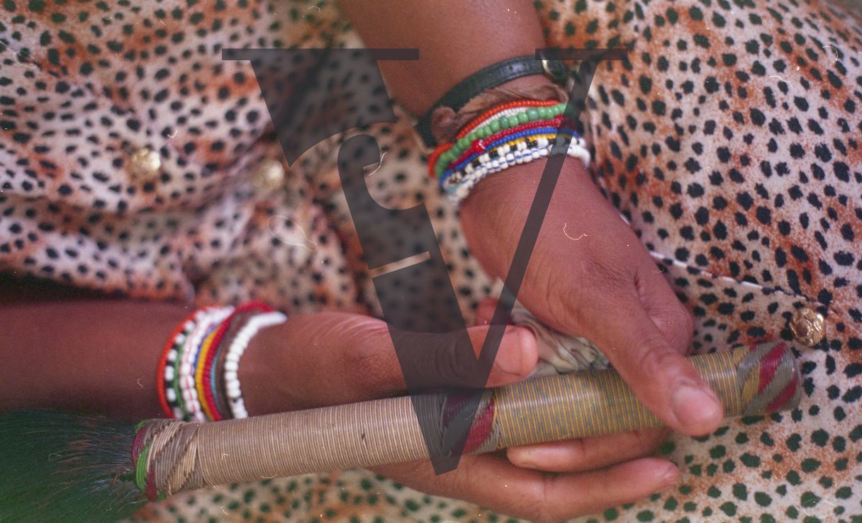 Sangoma, Zululand, Inyanga, crossed hands, Inyanga stick, close-up.