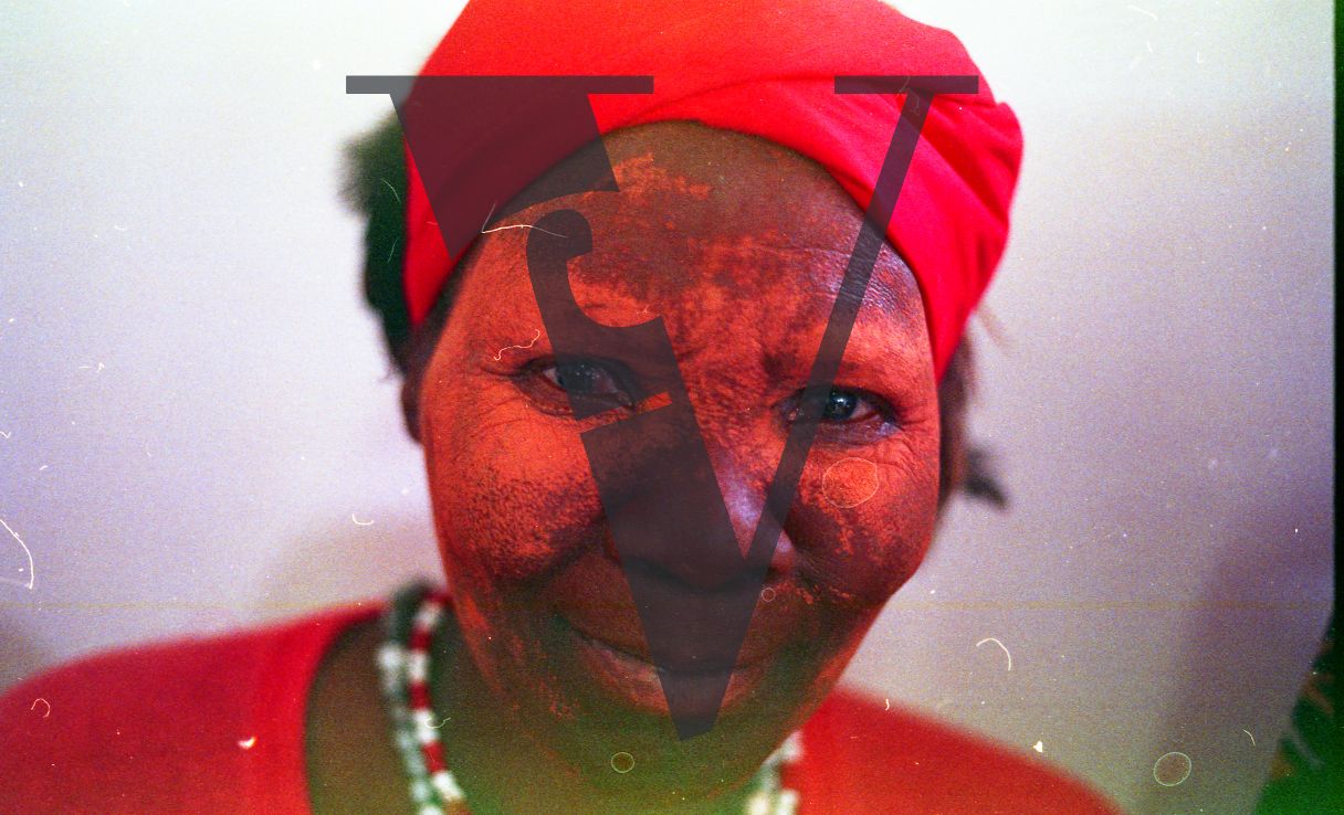 Sangoma, Zululand, Inyanga, Novitate Sangoma in red, portrait.