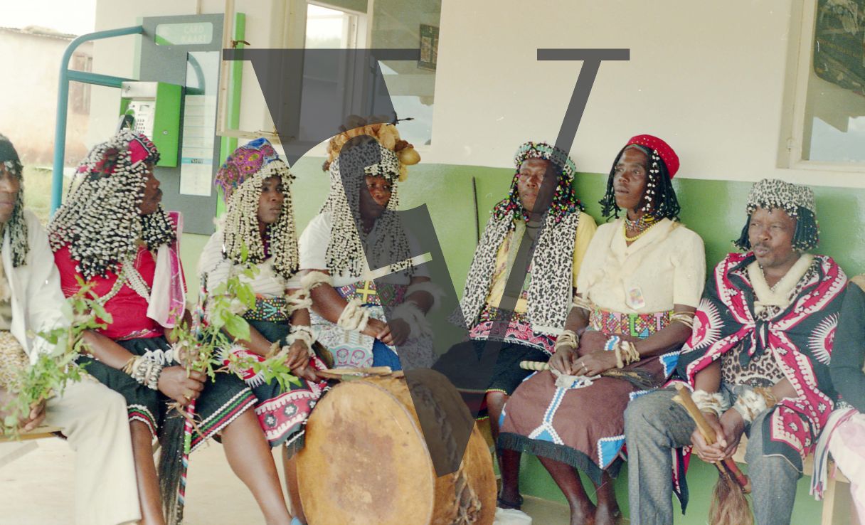 Sangoma, Zululand, Inyanga, group waiting, drum in centre.