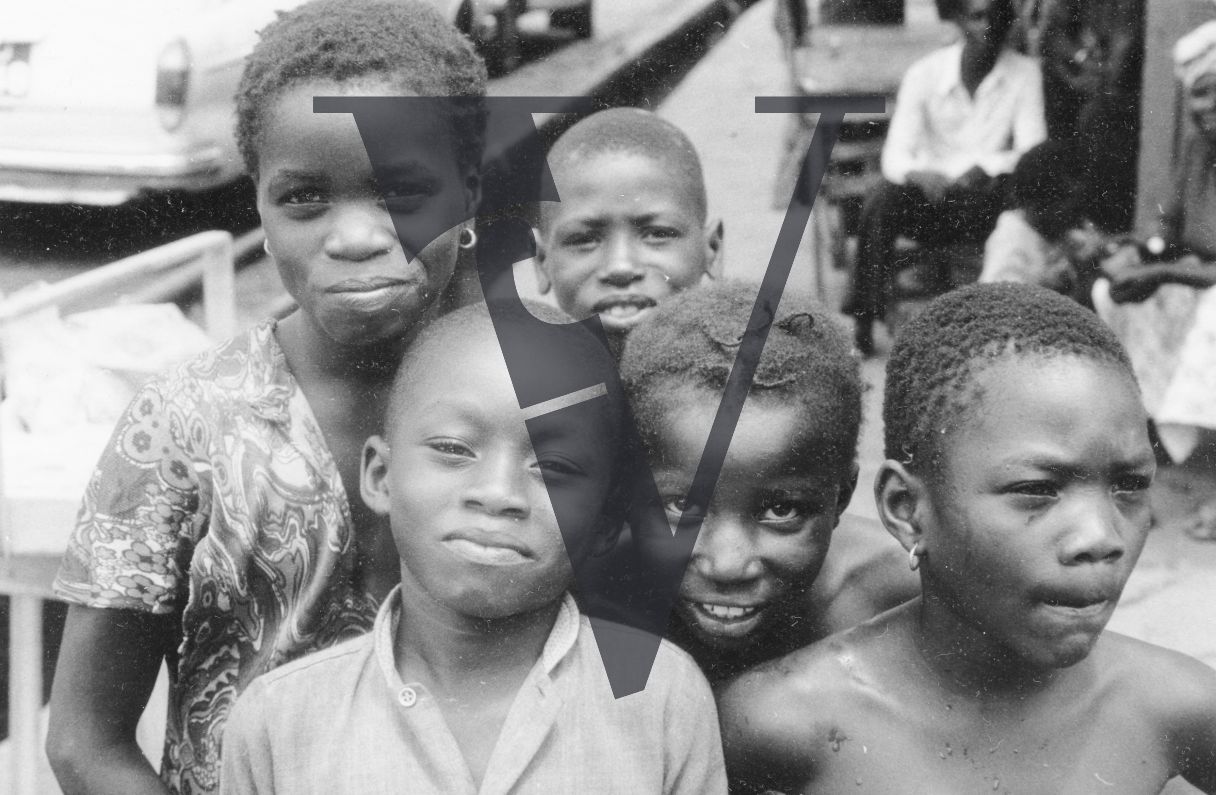 Sierra Leone, streets, portrait, children posing for camera.