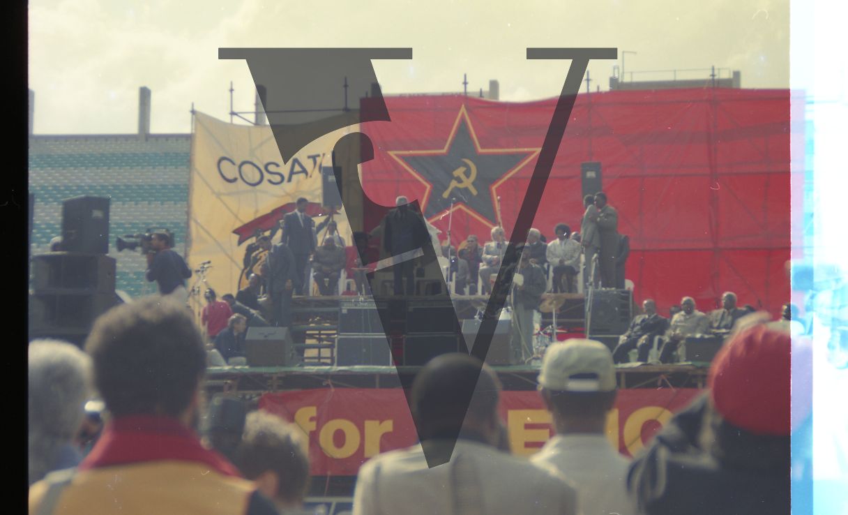 South Africa, Johannesburg, FNB Stadium, ANC rally, stage, Mandela addresses crowd, long shot.