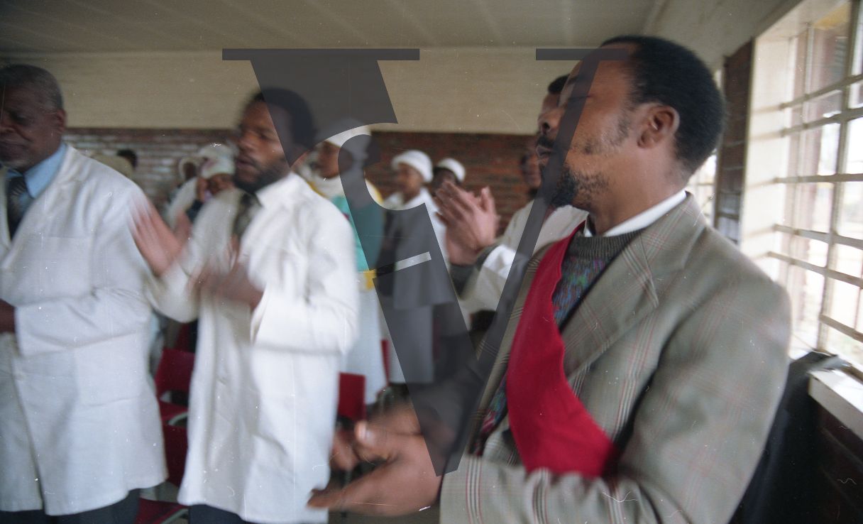 South Africa, church interior, congregation, clapping, dancing, mid-shot.