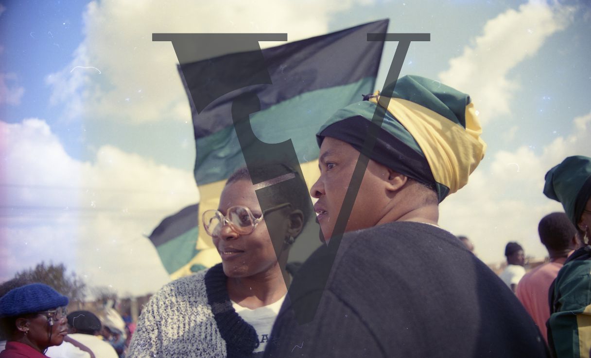 South Africa, ANC parade, two women, profile, flags.