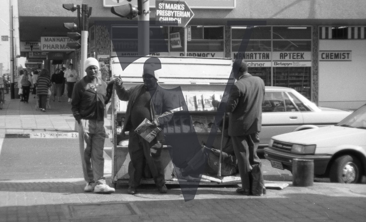South Africa, Johannesburg, street scene, newspaper vendor.