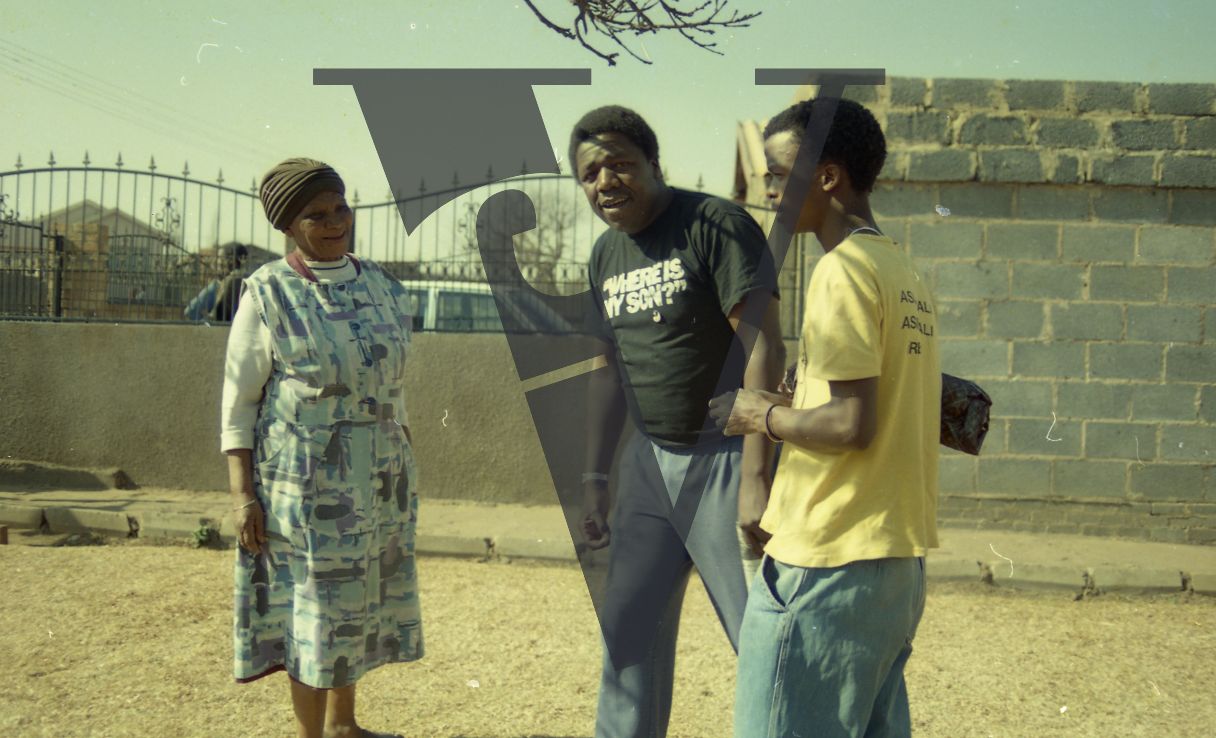 South Africa, Soweto, Peter Ngwenya with young man and woman, playwright.