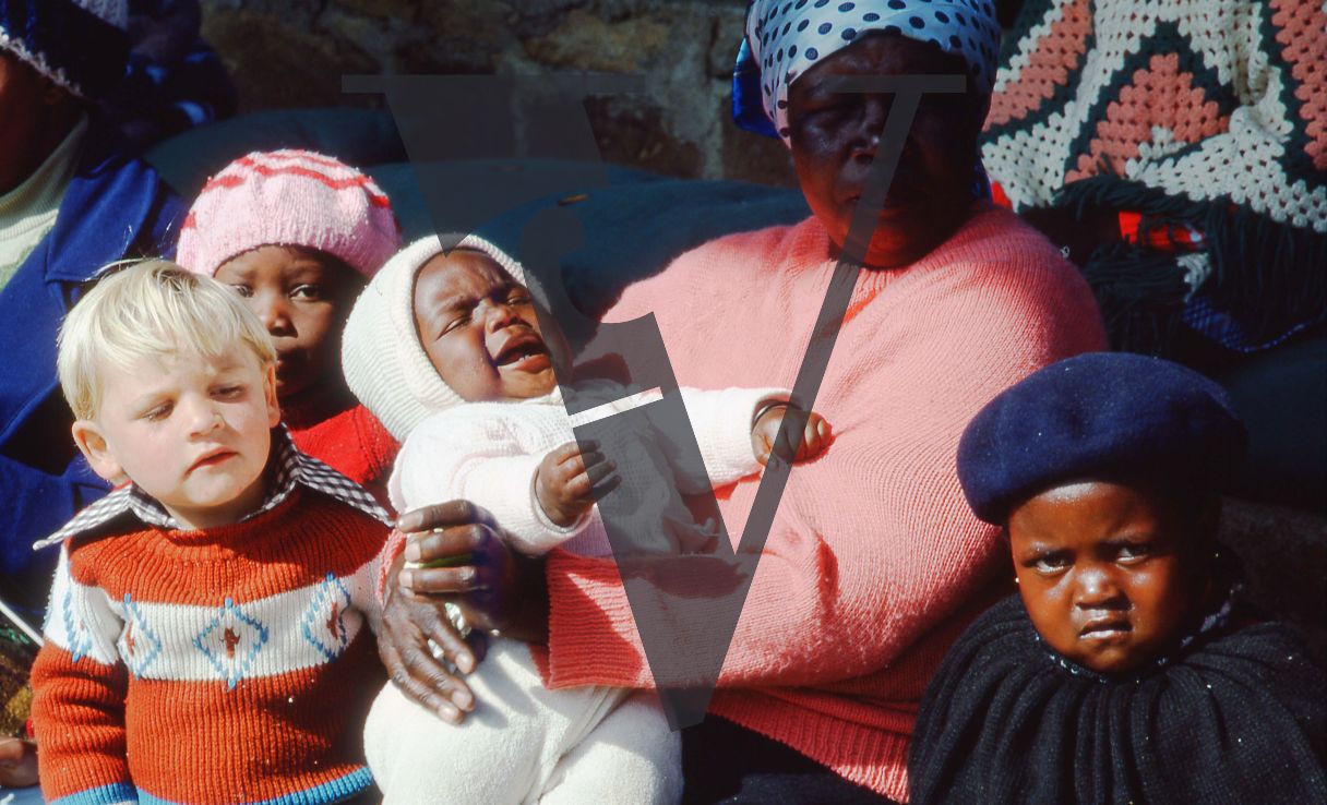 South Africa, Black nanny, three Black children, one white child.