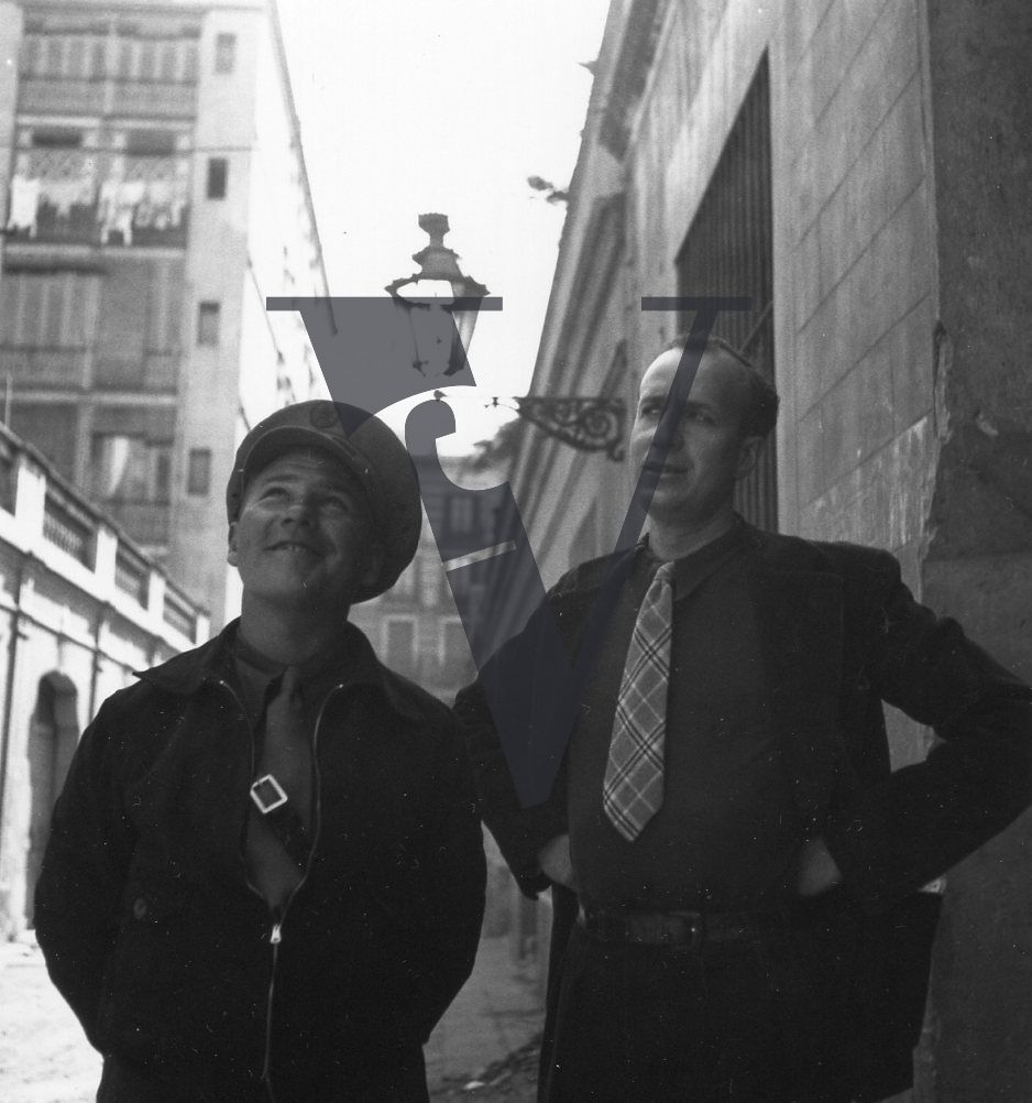 Spain, Barcelona, Herbert Matthews (right), mid-shot, exterior, buildings.