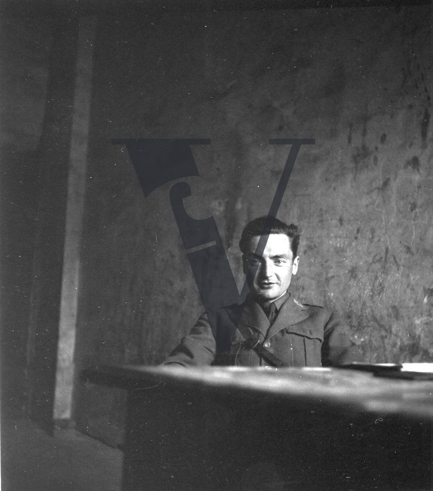 Spain, Malcolm Dunbar, portrait, seated, smiling, mid-shot.