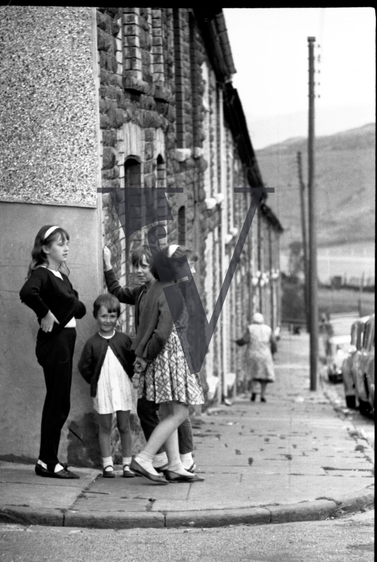 Tonypandy, Wales, Mining Community, girls playing on cobbled pavement, terrace houses.