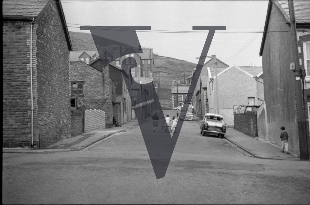 Tonypandy, Wales, Mining Community, street view towards the hills, children in street.