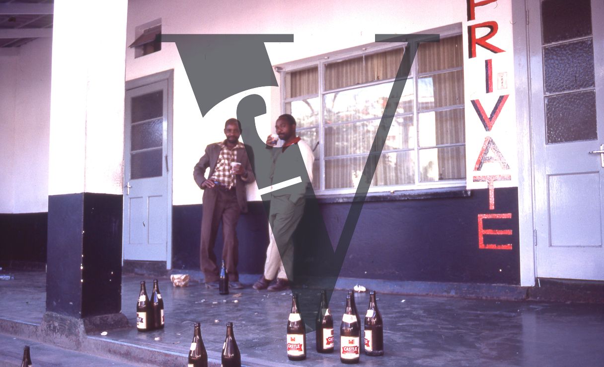 South Africa, Transkei, men drinking, portrait.