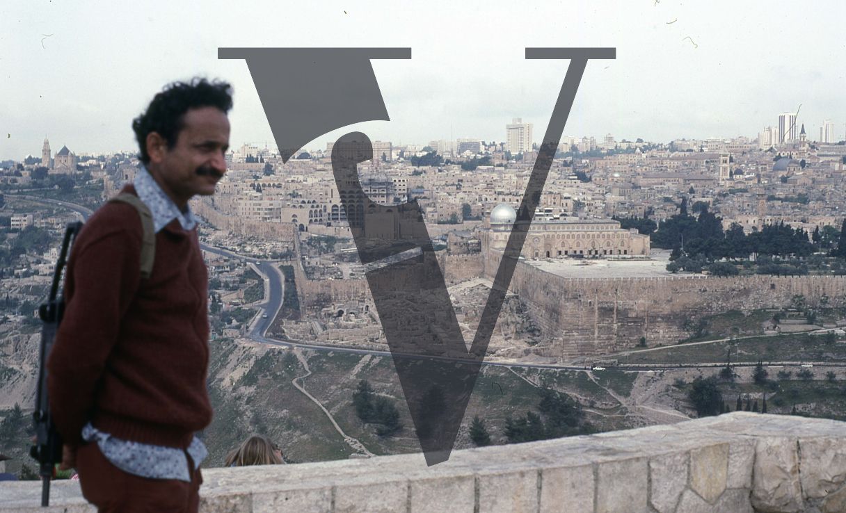 West Bank, wide-shot, city, man in foreground.
