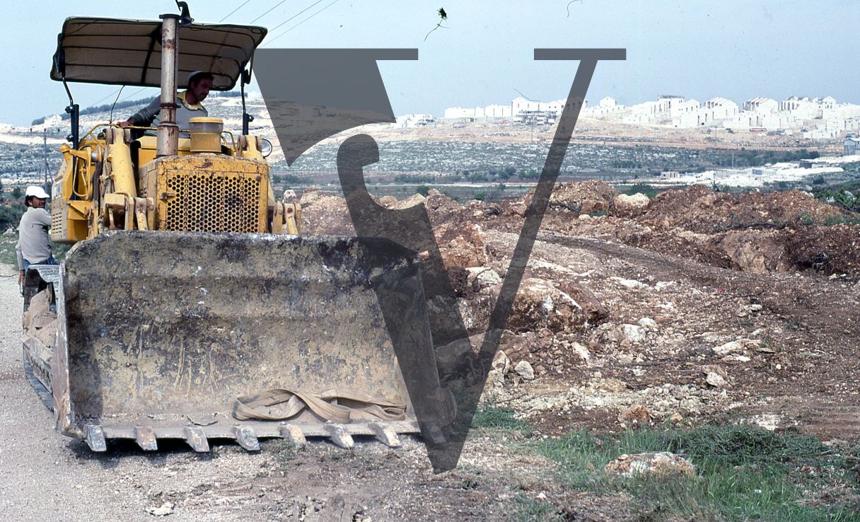 West Bank, settlement, Afrat, yellow bulldozer.