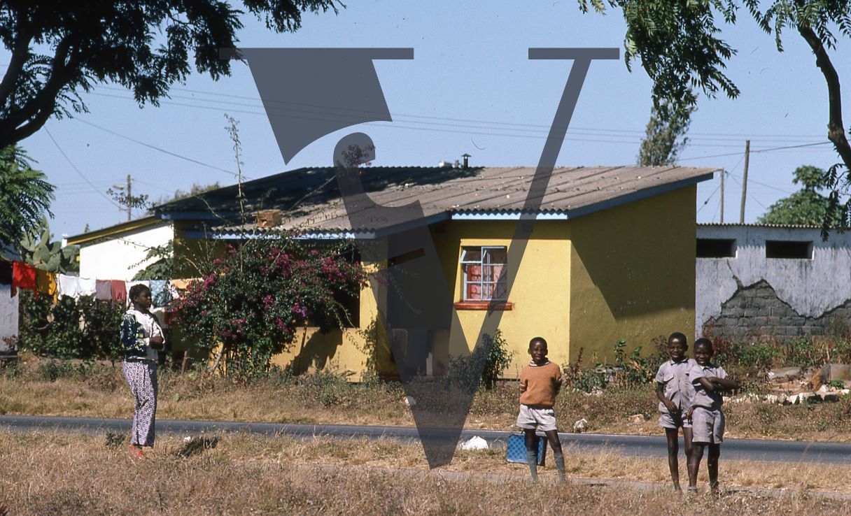 Zambia, Lusaka, houses, children playing.