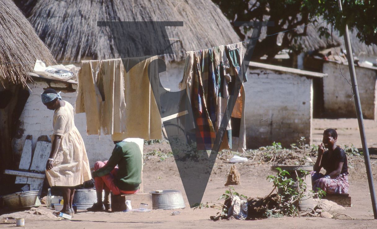 Zambia, Lusaka, houses, washing on the line, street scene.