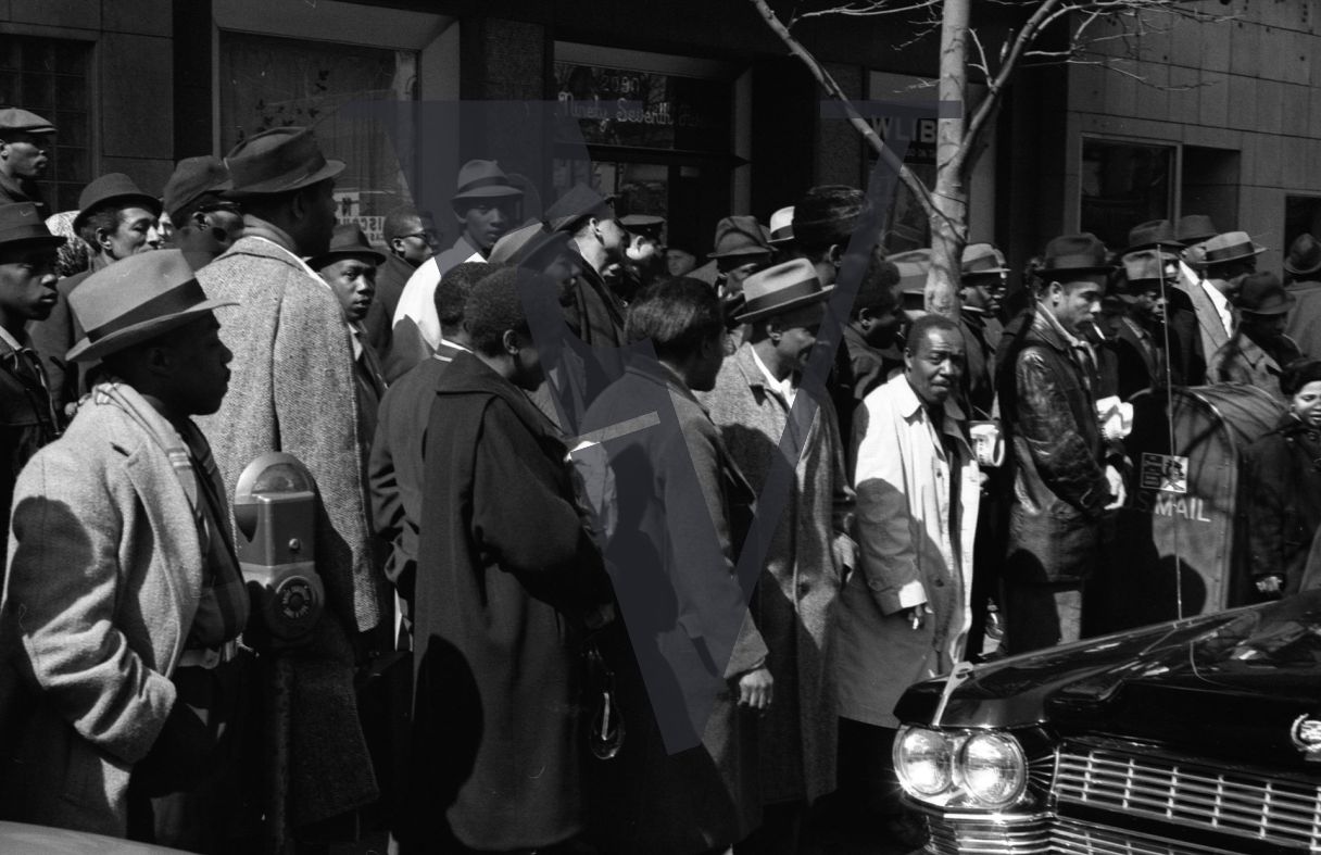 Cassius Clay arrives in Harlem, crowds gather.