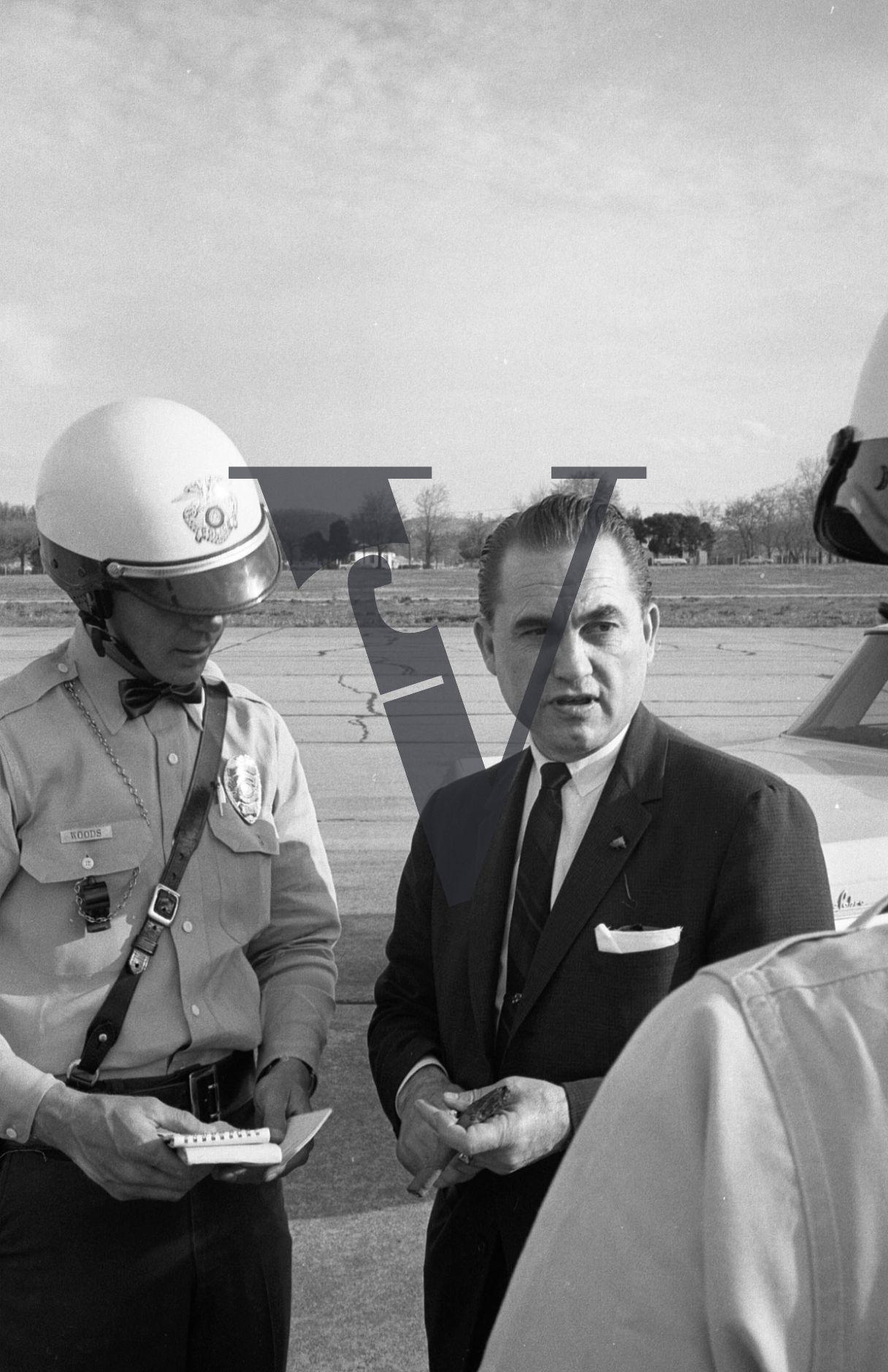 Governor George Wallace, with police, cigar.