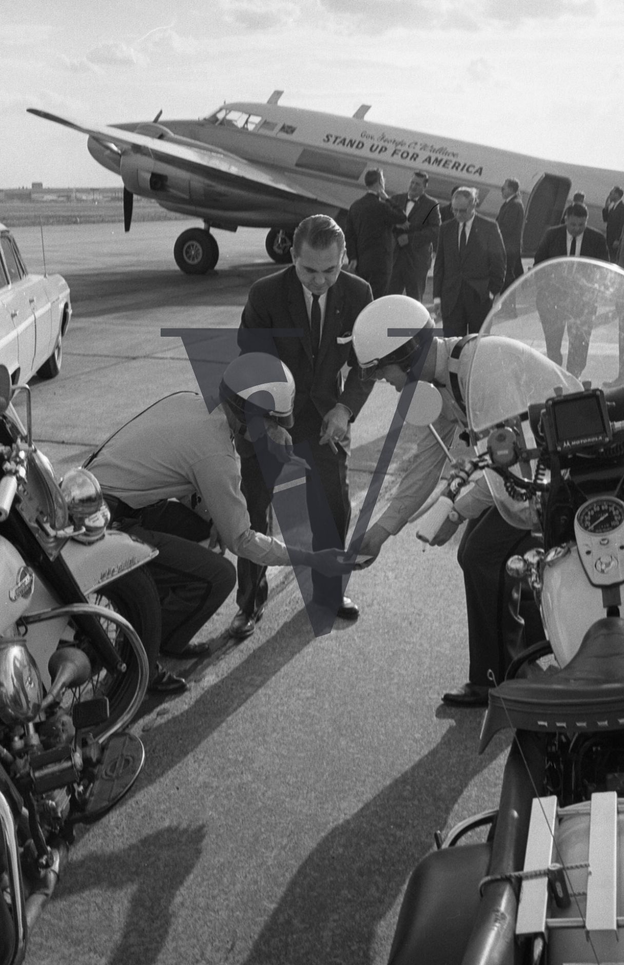 Governor George Wallace, Alabama, security police, motorbike, picking paper.